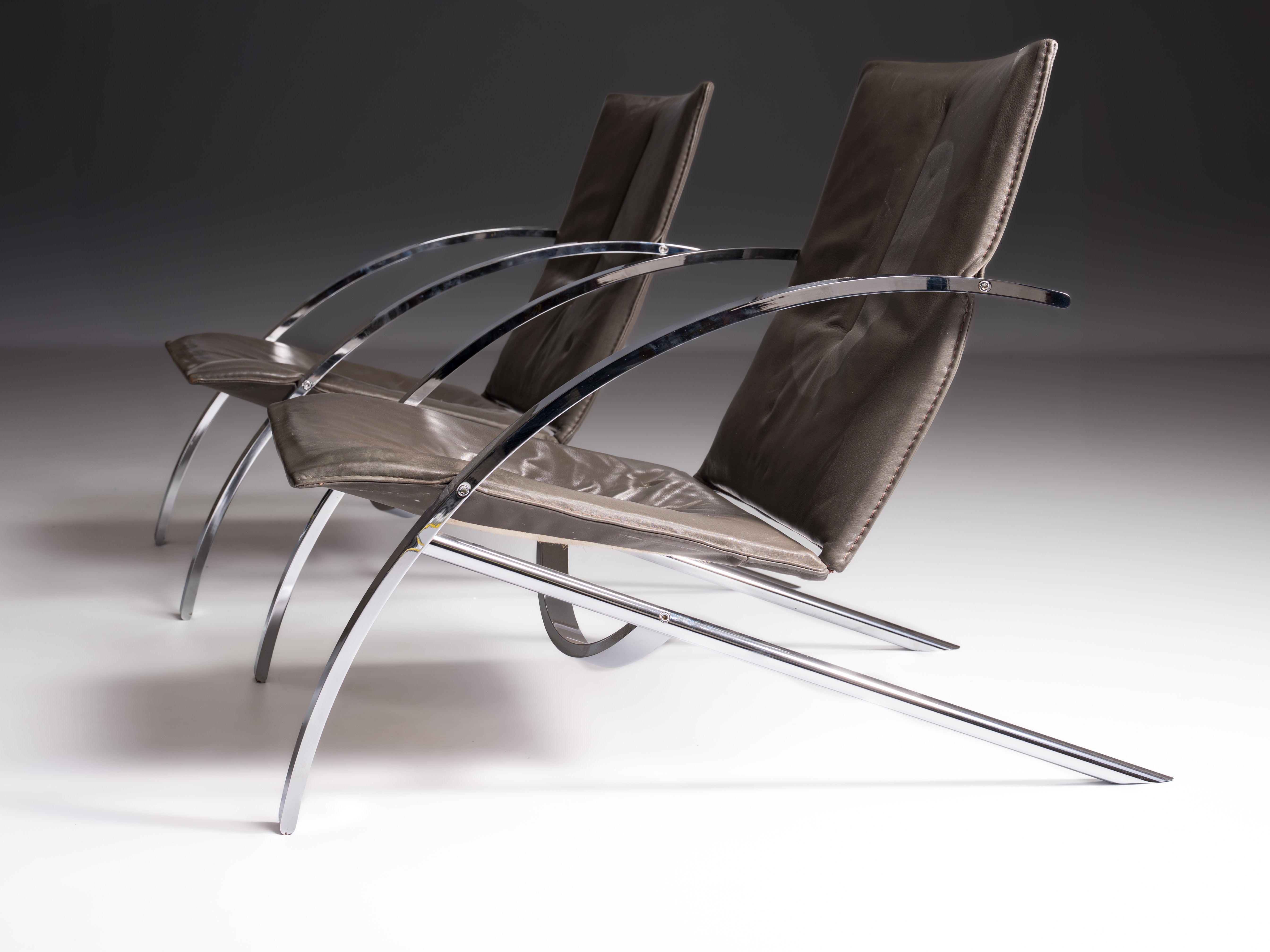 Pair of Arco chairs in stainless steel and black leather, Paul Tuttle for Strässle, Switzerland, 1970s