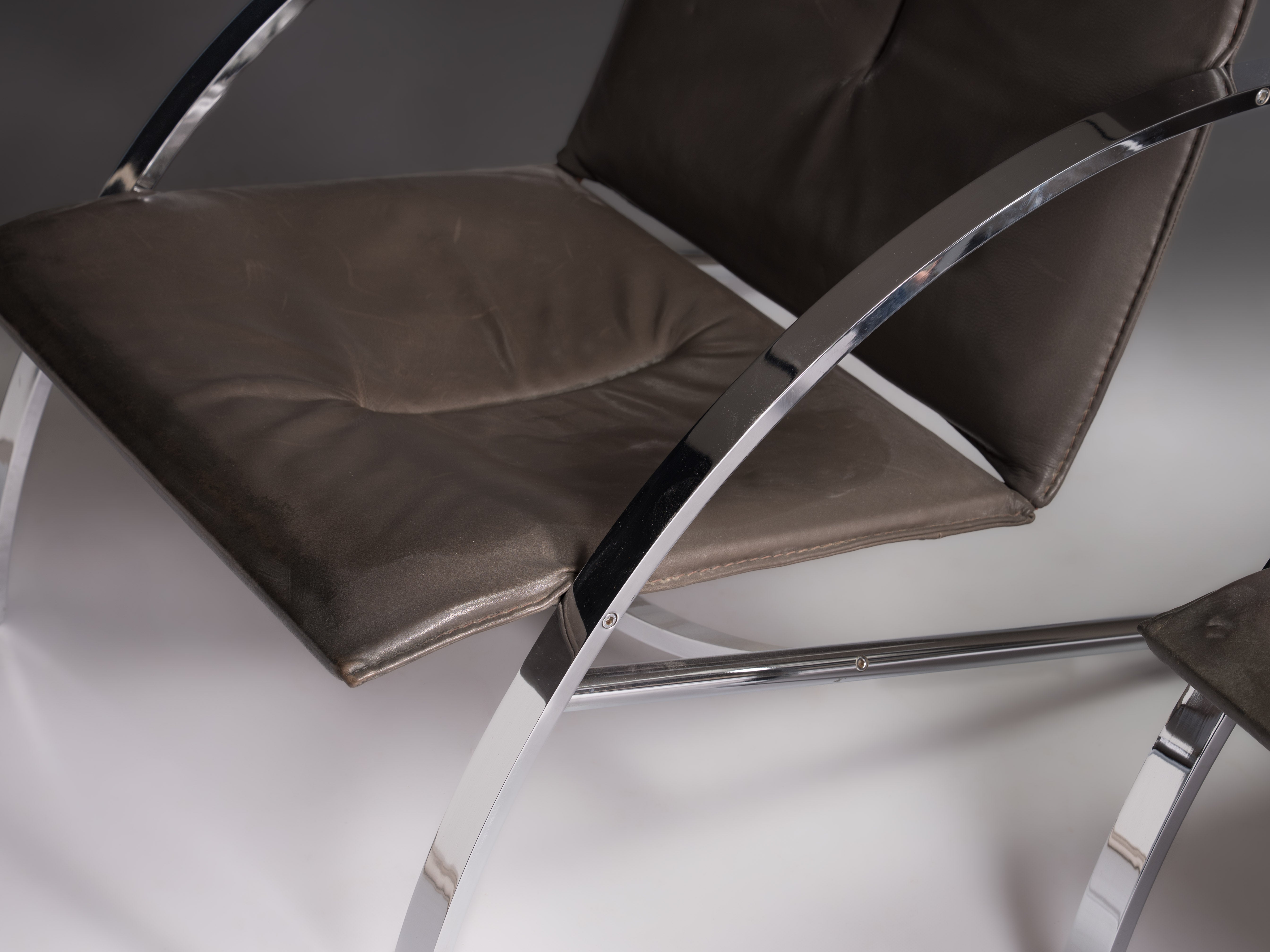 Pair of Arco chairs in stainless steel and black leather, Paul Tuttle for Strässle, Switzerland, 1970s