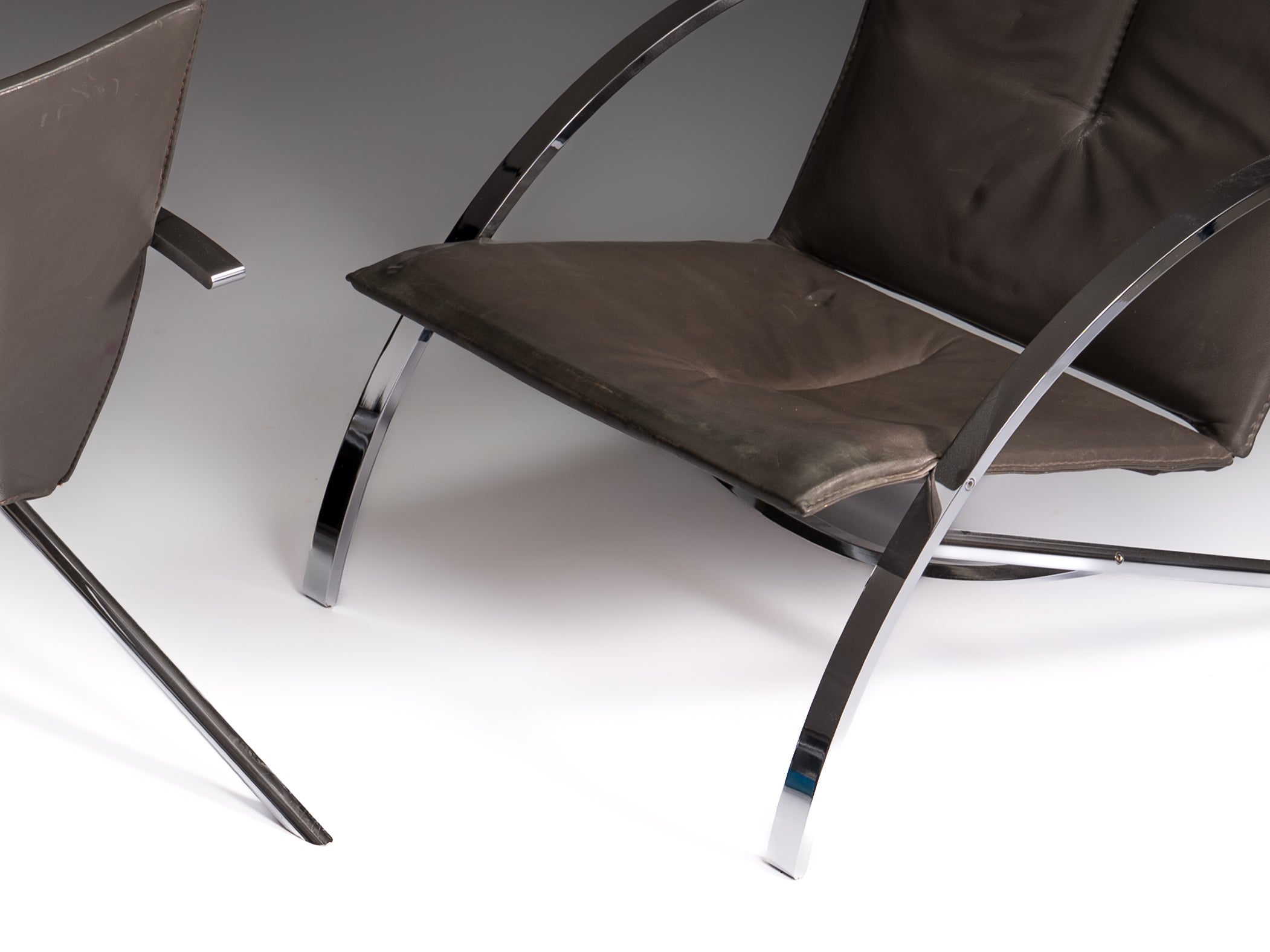 Pair of Arco chairs in stainless steel and black leather, Paul Tuttle for Strässle, Switzerland, 1970s