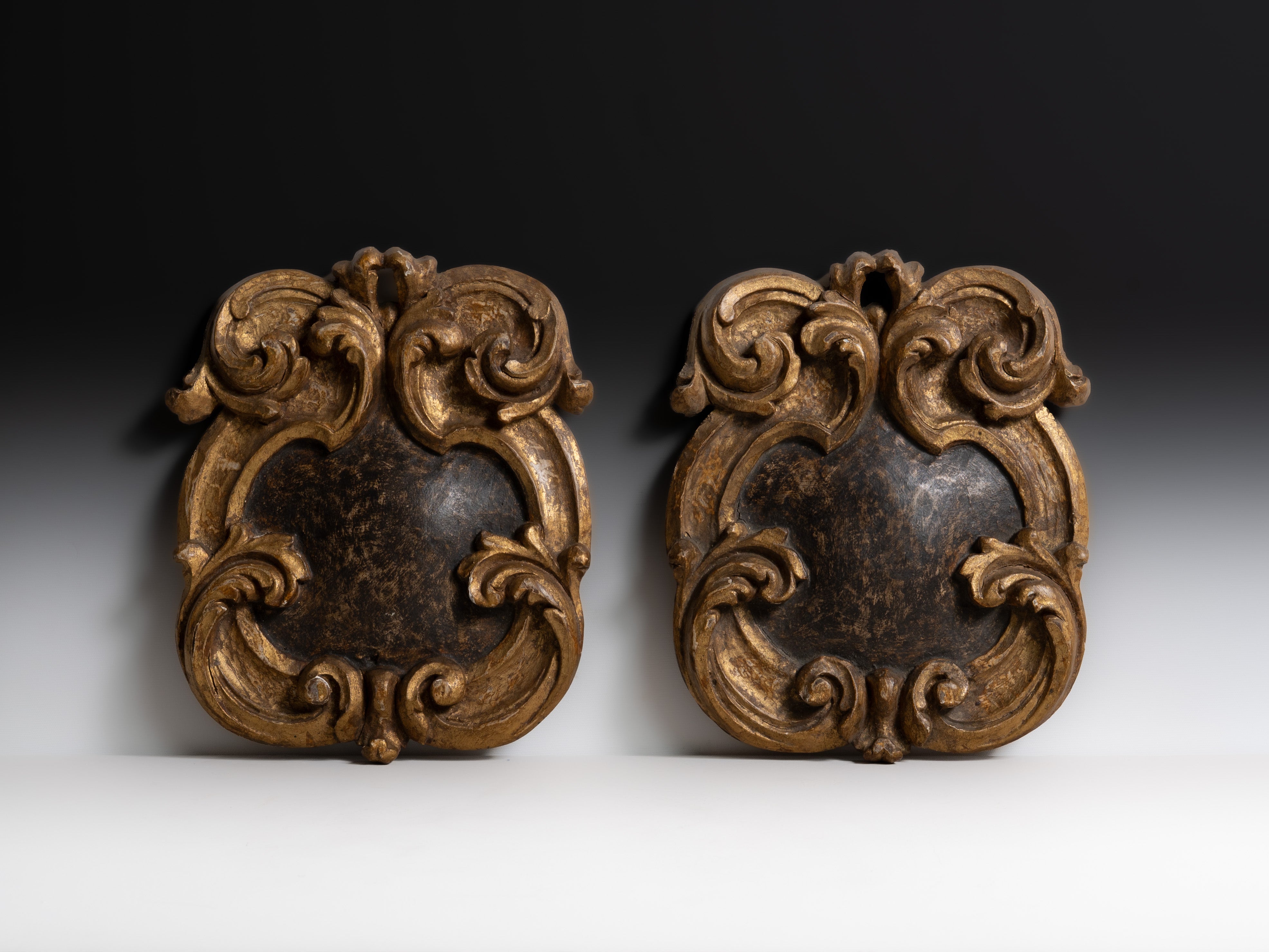 Pair of Portuguese carved and polychrome wooden carvings, 18th century.