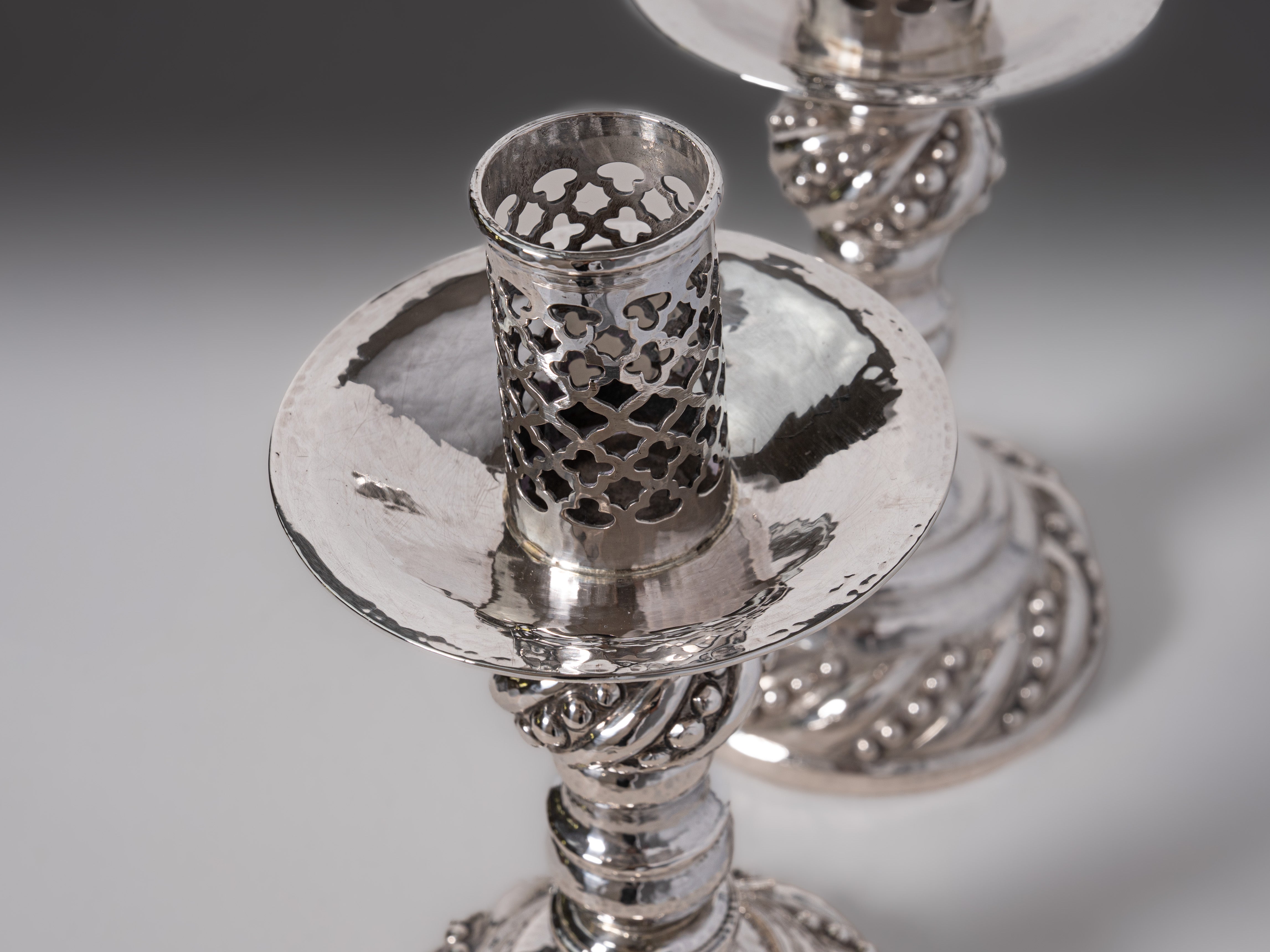 Pair of Portuguese silver candlesticks, Porto (eagle mark 833, 1938–1984), by Manuel Alcino (1935–1987)